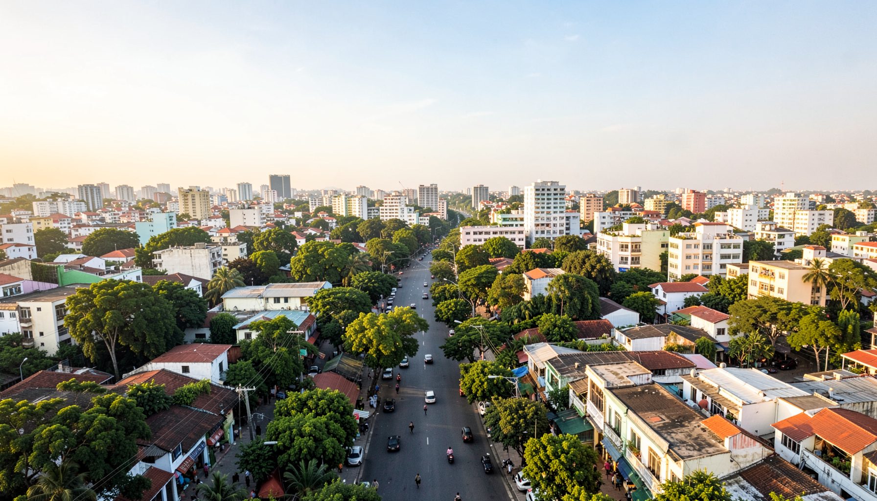 Aerial city view of Tân Bình district in Ho Chi Minh City with tree-lined streets and low-rise buildings under a bright sky